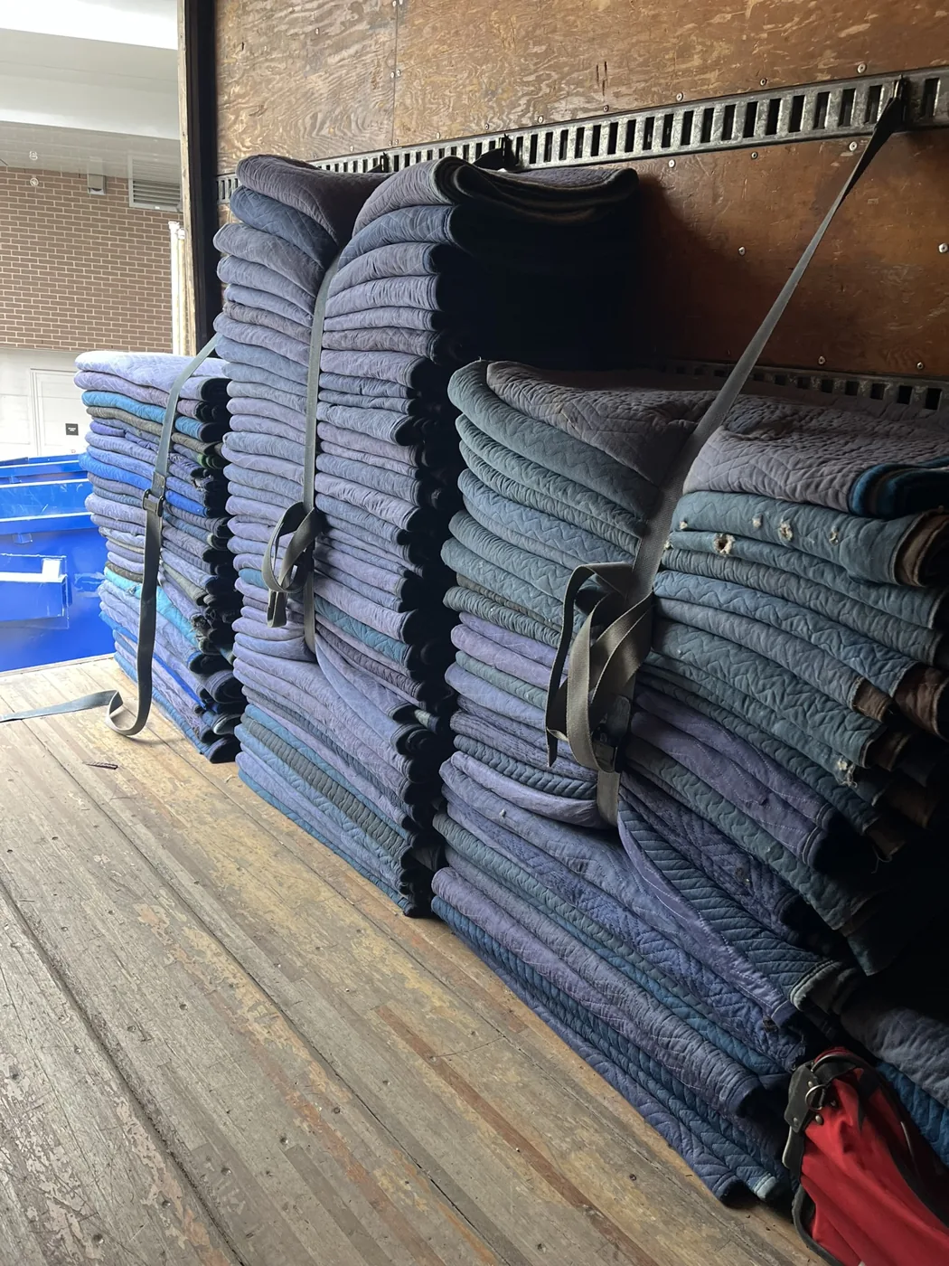 Moving blankets and protective equipment prepared by We Care Professional Moving